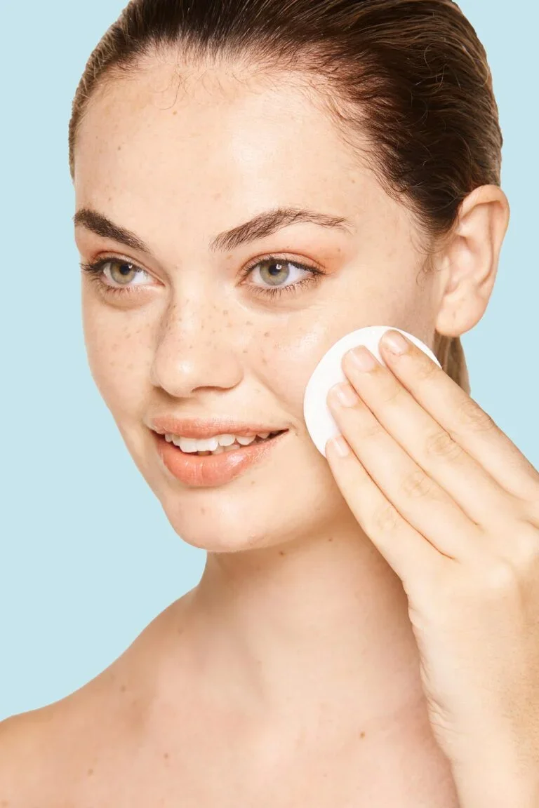 peaceful-female-applying-toner-on-radiant-face-wit-2022-03-04-05-43-08-utc-768x1152